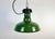 Industrial green enamel factory pendant light made in United States during the 1960s. White enamel inside the shade. Iron...
