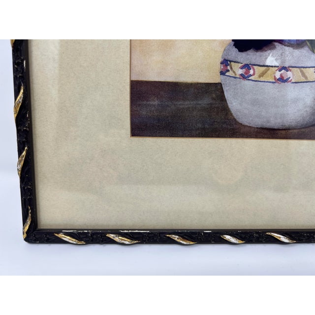 This antique floral still life print depicts a bouquet of blue and violet pansies arranged in a ceramic vessel, rendered...