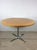 This mid century modern dining table features round butcher block top, original maple finish, and chrome pedestal base.