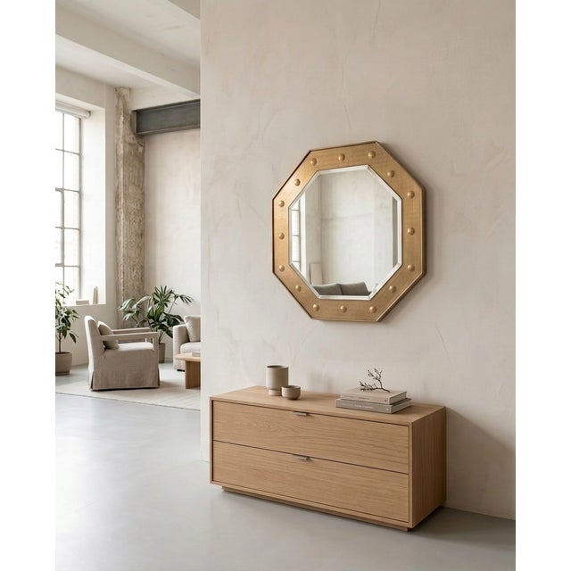 Large octagonal mirror made of mirrored crystal, brass frames, and a mirrored glass frame. The mirror consists of a...