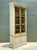 This impressive vintage tall cabinet embodies the timeless appeal of rustic craftsmanship with its beautifully distressed...
