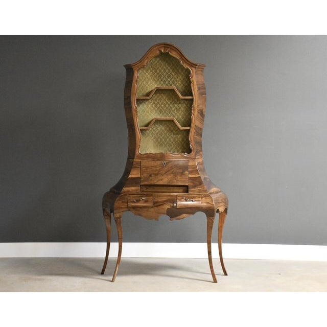 An elegant and rare bombe style secretary desk constructed of olive wood. Made in Italy. Circa 1950’s. Excellent...