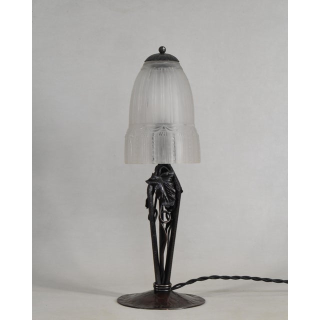 L. Varro & Muller frères A French 1925-1935 art deco lamp in wrought iron and pressed glass. It is made by L. Varro. A...