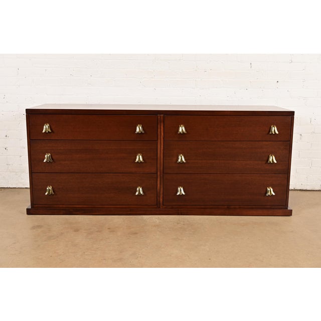 An exceptional mid-century modern Hollywood Regency six-drawer double dresser, credenza, or chest of drawers By T.H....