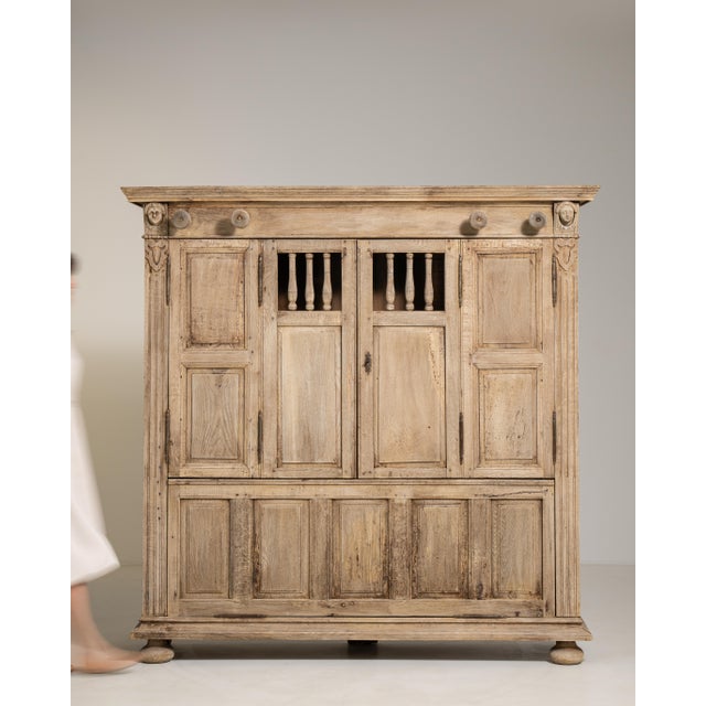 Crafted in France during the early nineteenth century, this distinguished oak cabinet exemplifies the refined sensibility...