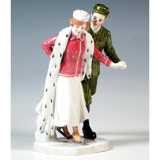 Delicate meissen art nouveau porcelain group: skating couple in elegant winter clothing: the lady in a long white skirt,...