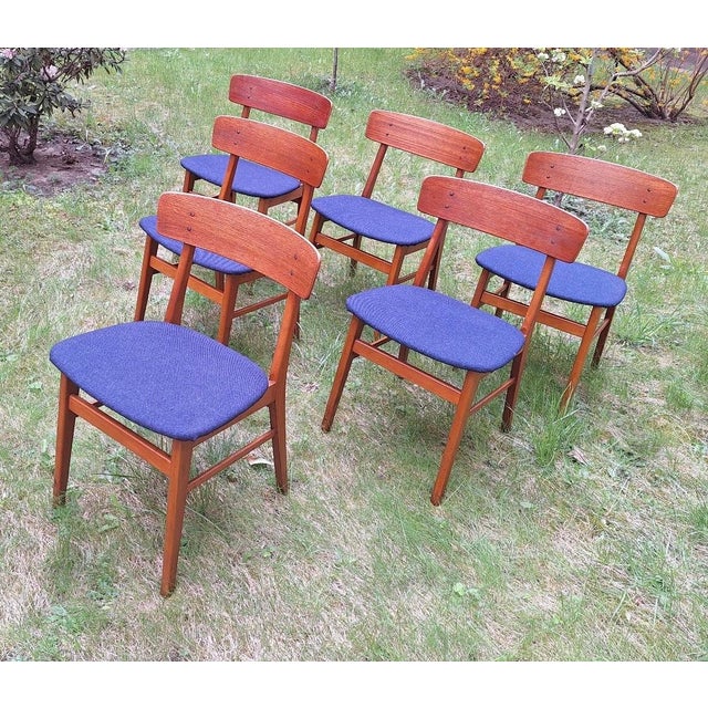 Finely constructed set of Danish teak and beech dining chairs by Farstrup, the seats re-covered with navy blue structured...