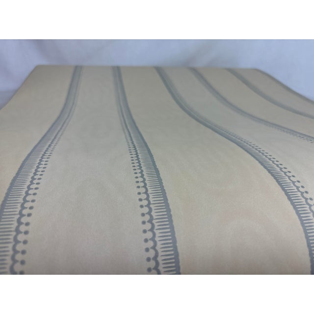 This striped Nina Campbell wallpaper is ready-trimmed and wipeable. It was distributed by Osborne & Little. It features...