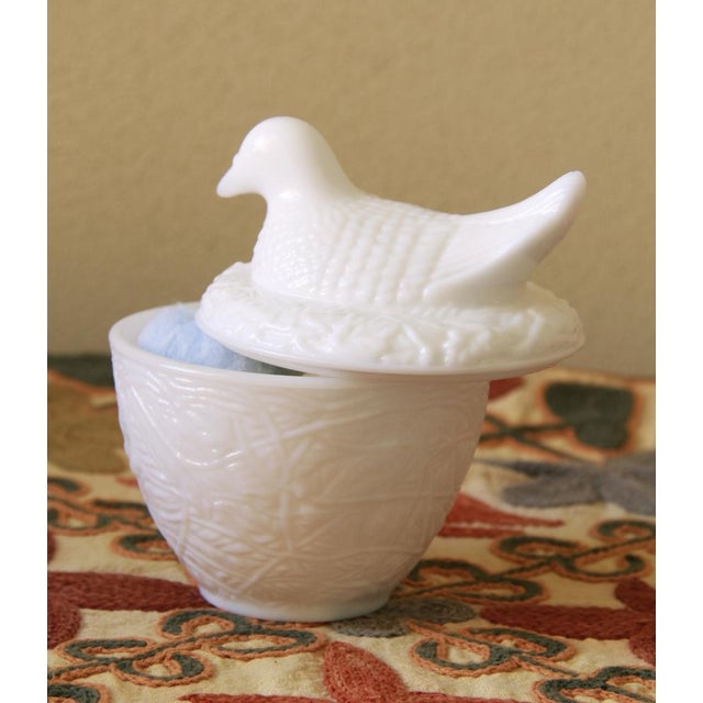 Gallina is a vintage charming milk glass hen on nest from Avon's 1970s decorative collection. Made of opaque white glass,...