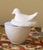 Gallina is a vintage charming milk glass hen on nest from Avon's 1970s decorative collection. Made of opaque white glass,...