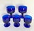 Here is a fabulous set of five vintage cobalt blue stemmed glasses, likely dating to the mid-20th century. The rich,...