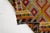 This is a vintage Turkish Oushak rug from the Mid 20th Century. The piece was hand-knotted.