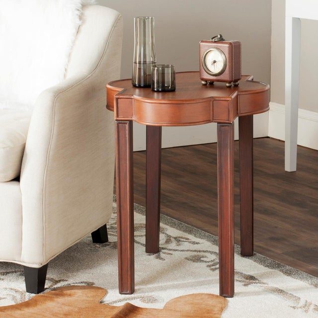 A beautiful addition to transitional or traditional rooms, the Mizel end table in warm brown is designed with curvaceous...