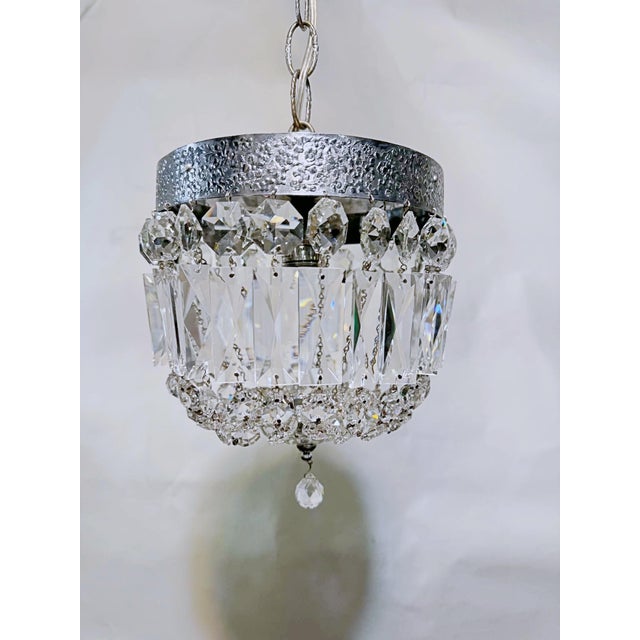 Bring a layer of crisp mid-century glamour and sophisticated geometry to your home with this exceptional vintage crystal...