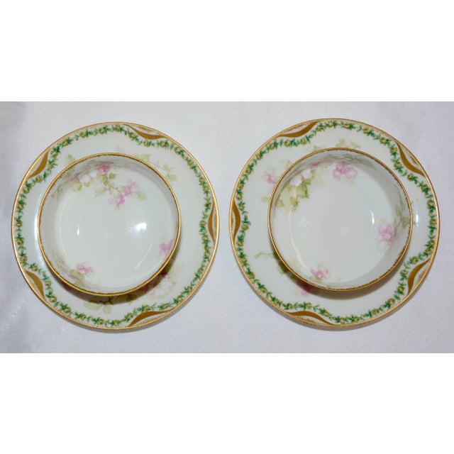 Apple Blossom's adorn these small cream soup bowls and saucers made by Haviland & Co. Limoges of France. Garlands of vines...
