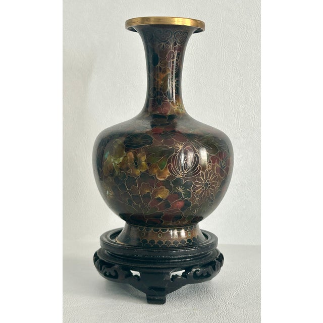 Vintage (1980's) Cloisonné Vase with Wooden Base has an Asian Style. Multi-colored. The Measurements: 4"W x 6.5"H / With...