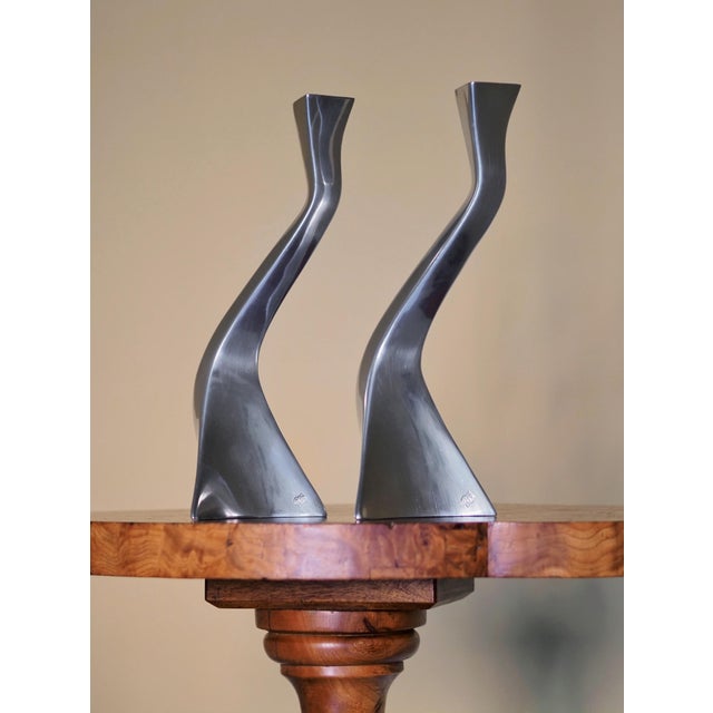 A pair of vintage 1980s mid century modern brushed silver chrome candleholders by FR Portugal. These futuristic angular...