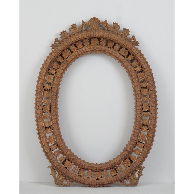 Large, intricately carved wooden frames. The carvings feature floral motifs. The frames date from the first half of the...