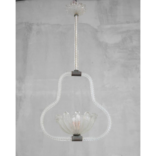 Art Deco style chandelier made of Murano glass made in Italy in the 1940s by Ercole Barovier. The chandelier has a new...