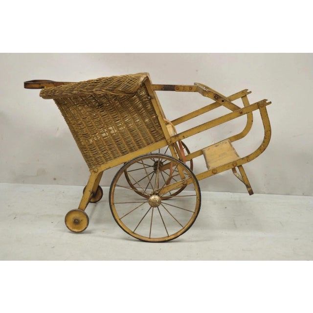 Antique Victorian Wicker & Metal Baby Carriage Pull Behind Stroller Dog Carrier. Item features wicker seat, metal frame,...