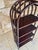 Vintage, bamboo and rattan, 4-tiered floor shelf / bookcase circa 1960's. Piece has four shelves made of a dark-brown...