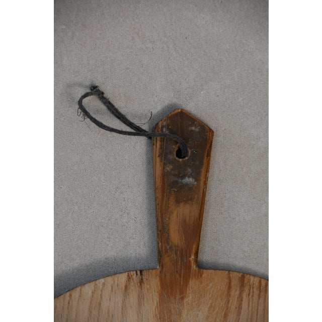 These Early 20th Century antique European breadboards are hand-carved from solid wood and worn beautifully with age....