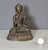 Bronze Buddha seated on a lotus flower, origin Nepal, late 19th century, note one finger is missing
