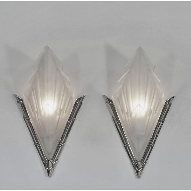 Jamain & Degué A nice pair of 1933 French art deco wall sconces in nickel plated solid brass or bronze by C.Jamain holding...