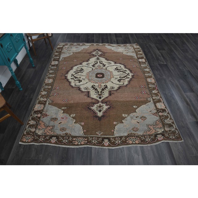 Vintage Hand-Knotted area rug is a semi-antique vintage area rug. The '70s Eastern region of Anatolia's unique rug is...