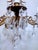 This is a decorative Spanish brass chandelier with 30% leaded almond cut drop crystal and octagon chain. The chandelier it...