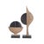 Black marble discs peek out from textural "pods" of ash-brown resin to resemble peas emerging from their shells. Each...