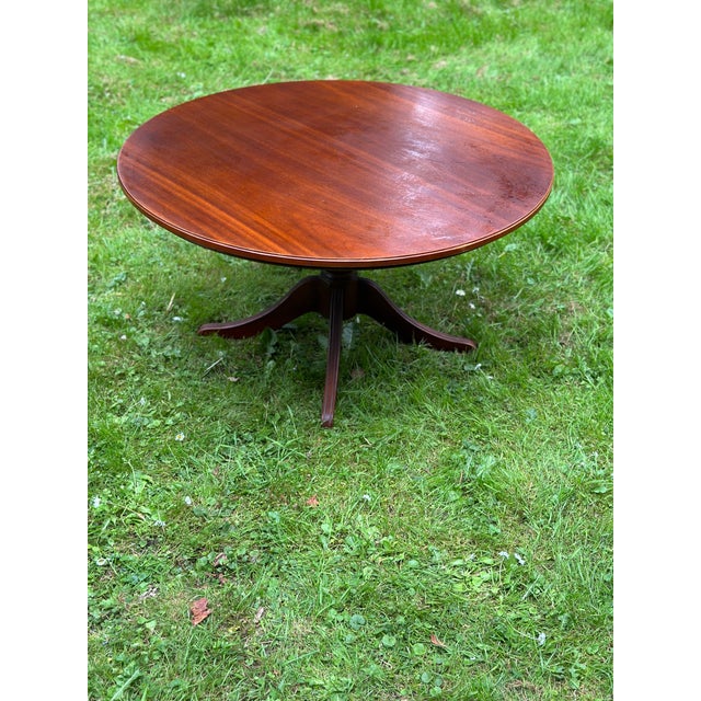 Nice round coffee table with a classic design, constructed from wood. Key features: * Shape: Circular tabletop. *...