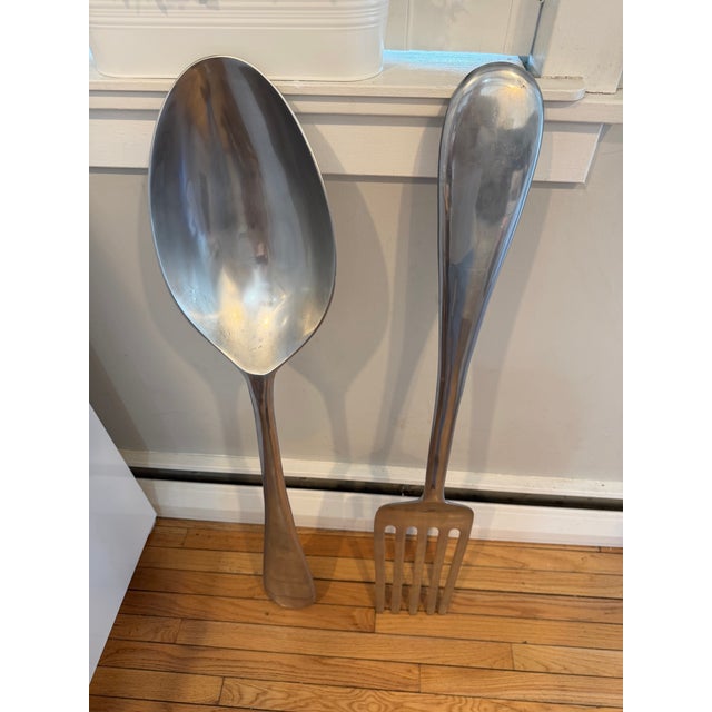 Curtis Jere form and spoon wall hanging sculptures. Made out of silver aluminum. H: 46.5”