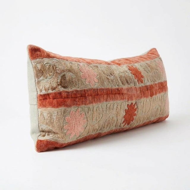This beautiful 13'' x 48'' hand-embroidered Suzani pillow cover was made from authentic Uzbek cotton fabric. The intricate...