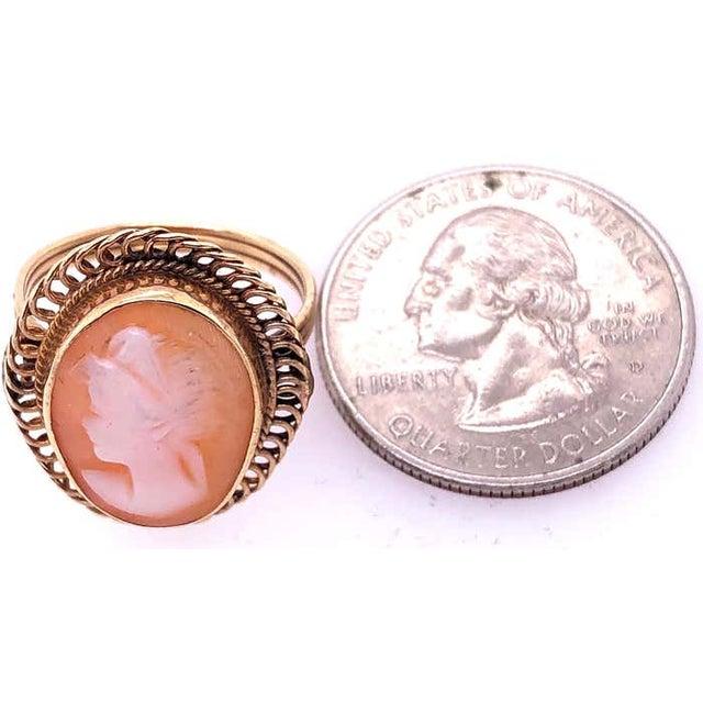 14 Karat Yellow Gold Swirl Framed Cameo Ring Size 6.5. 3 grams total weight.