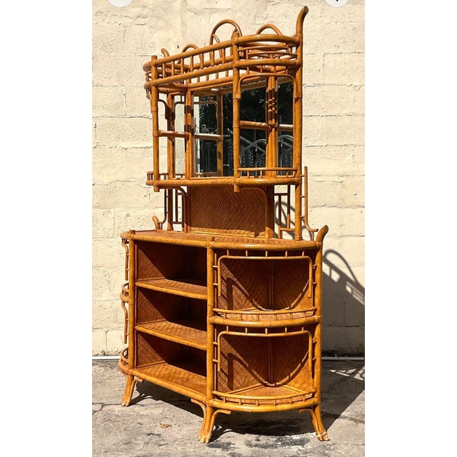 A stunning vintage Coastal dry bar. Gorgeous bent rattan with inset woven rattan panels. Gorgeous mirror hutch on top....