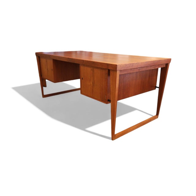 A model 70 desk designed by Kai Kristiansen for Feldballe Møbelfabrik. with its elegant silhouette and high quality, the...