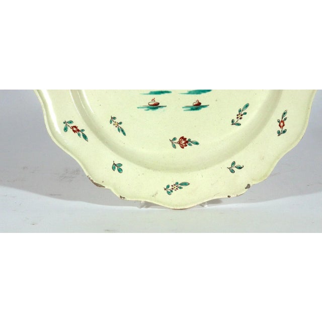 Pair of Large English Creamware Chinoiserie Dishes, Circa 1780 A pair of big, pale, quietly funny English creamware...