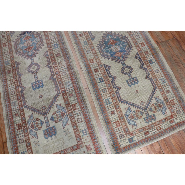A matching pair of persian tribal runners from the early 20th century. 2'11'' x 13'9'' & 2'9'' x 13'9'' respectively