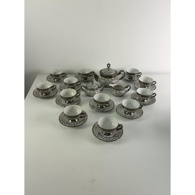 Bavarian porcelain tea set for 12, "Mitterteich," 1931 Consisting of 12 cups and saucers, a teapot, a milk jug, and a...