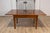 This exquisite Italian walnut folding table from the early 19th century embodies classic elegance with practical...