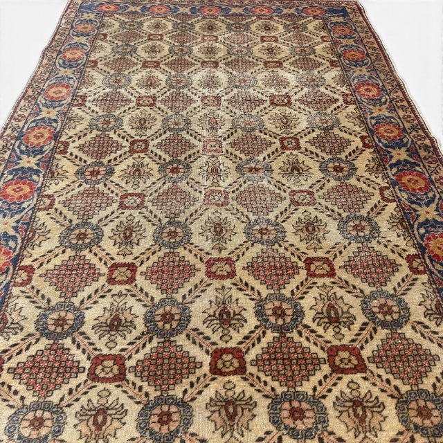 This antique Turkish rug from the Cappadocia region, approximately 90 years old, showcases a beautifully structured...
