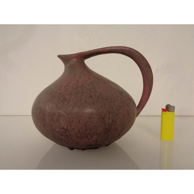 Ceramic 313 handle vase by Kurt Tschörner for Ruscha. Inscribed on the bottom. Very good condition. This piece has an...