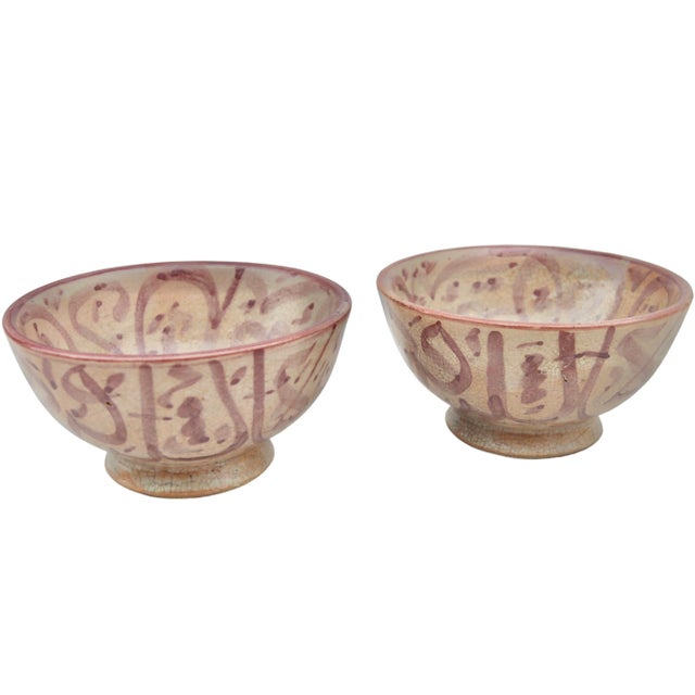 Stunning set of two antique handcrafted and glazed Moroccan ceramic bowls with an elaborate hand-painted Arabic...