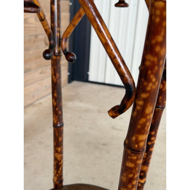 A wonderfully detailed antique Victorian bamboo pedestal table dating to the late 19th or early 20th century. The tall,...