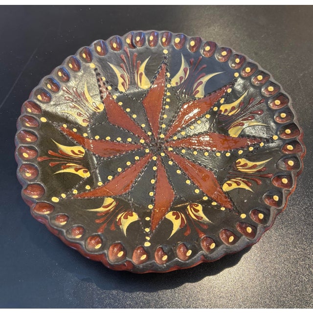 This beautiful Eldred Pottery bowl is approximately 8 3/4 inches in diameter. It features pinwheel and dot design. The...