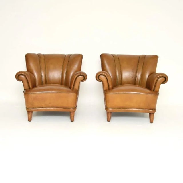 A superb pair of vintage Swedish leather club armchairs. They were recently imported from Sweden, they date from around...