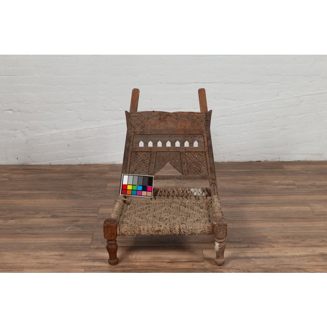 Rustic Indian Low Wooden Chair With Rope Seat and Weathered Appearance For Sale - Image 4 of 16