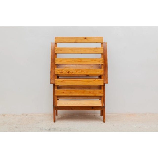 Vintage outdoor chairs. Solid wooden slat construction with armrests. Foldable for easy storage. Dimensions: 63 W x 97 H x...