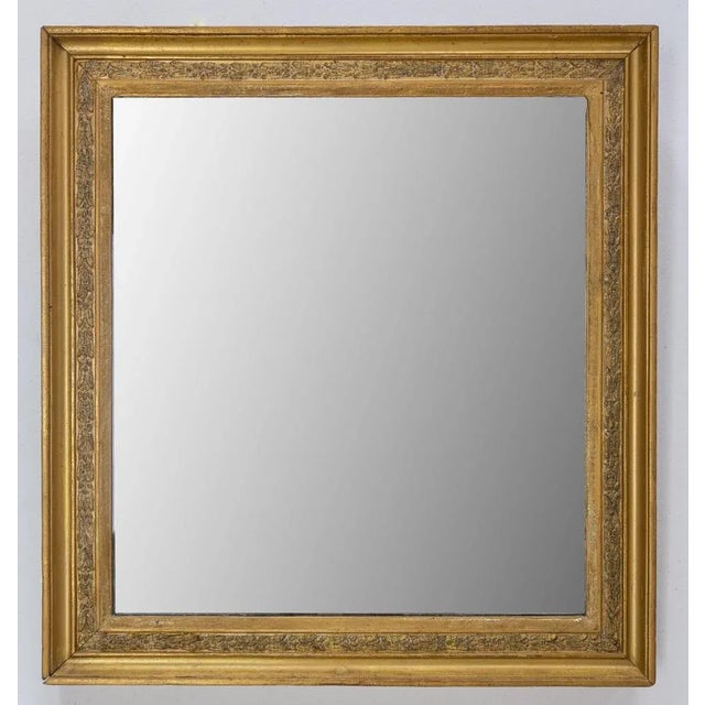 French golden stucco mirror Beautiful frame with vegetal patterns Original mirror Made circa 1900. Wear consistent with...